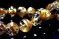 画像1: 透明度高い!贅沢な金針!キャッツアイタイチンルチルクォーツ7mm玉ブレスレット(ブラジル産)  (1)